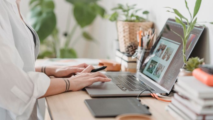 a woman is typing on her laptop computer at The  Jaxon