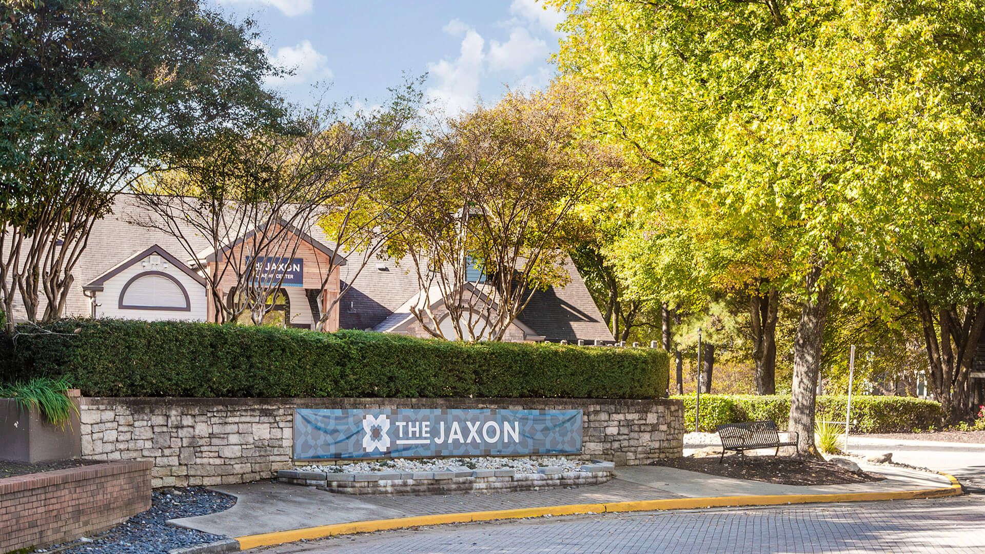 the entrance to the park and trees at The  Jaxon